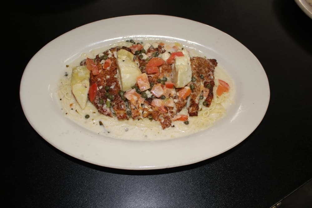 The entree ($12.95) includes capers, diced tomatoes and artichoke hearts in a lemon wine sauce. (Photos by Eva Vigh/Community Impact Newspaper)