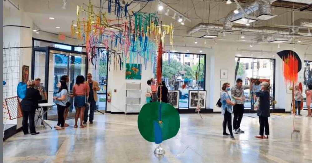  Patrons viewing the art on exhibition at the Art Museum TX in Sugar Land.