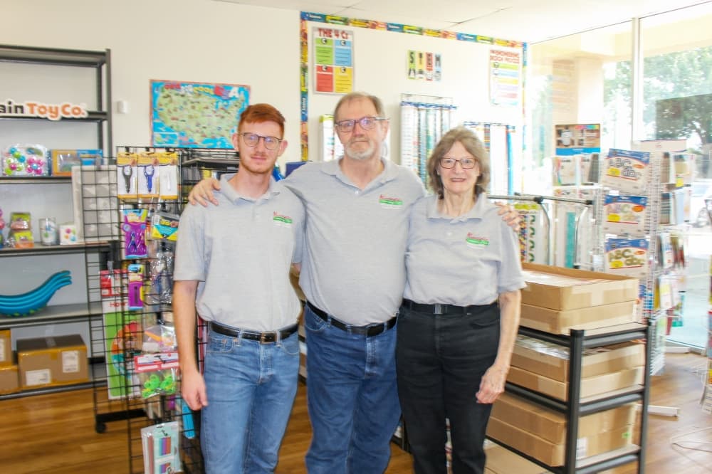 Jeff Schuett (center) owns and operates Funtastic Learning Toys alongside his son Henry (left) and mother Sharon (right), who serves as the company’s president. (Wesley Gardner/Community Impact Newspaper)