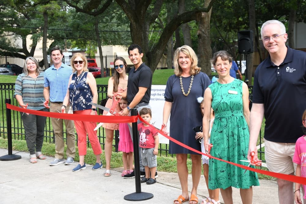 Friends of West University Parks Fund committed to almost $200,000 to cover the cost of the park’s improvements. Pictured here are board members, city council members, and members of the Doustan family, who sponsored the playground. (Hunter Marrow/Community Impact Newspaper)