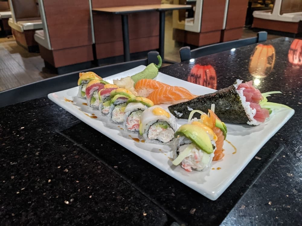 
Chef Wade Lin said raw dishes at Sakura, such as the Salmon Nigiri ($10), Rainbow Roll ($11.50) and Tuna Hand roll ($13), are made with more seafood than rice to reach higher levels of quality. (Photos by Warren Brown/Community Impact Newspaper)