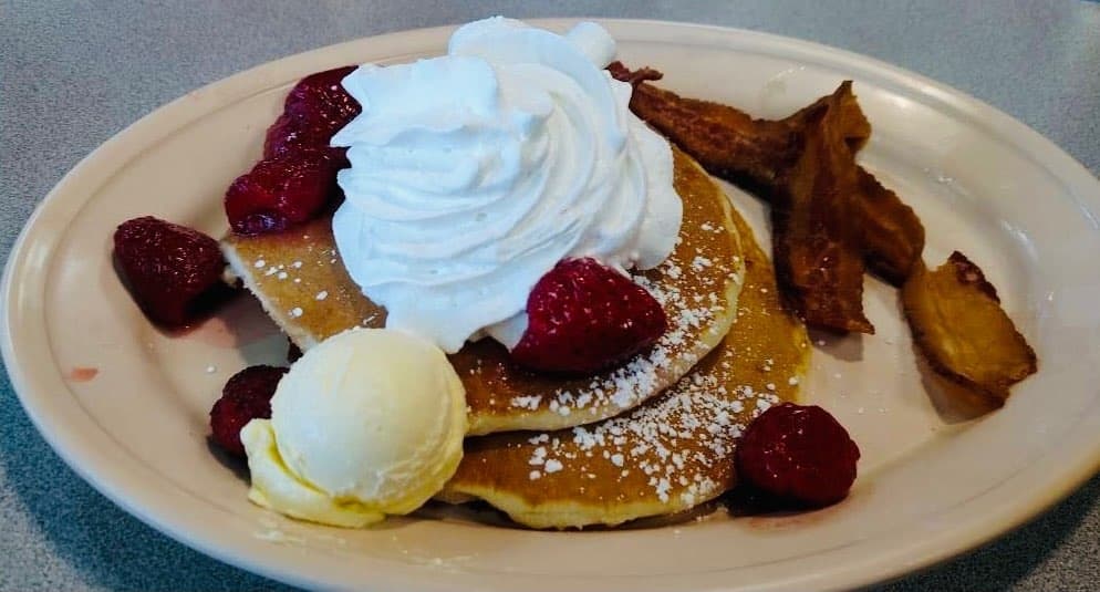 The specialty pancakes ($3.49 for one, $5.99 for two, $8.99 for three) come with several topping options, including strawberries and cream, pineapple upside-down, blueberry, and banana-Nutella. (Courtesy Beacon Cafe on Beach Street)