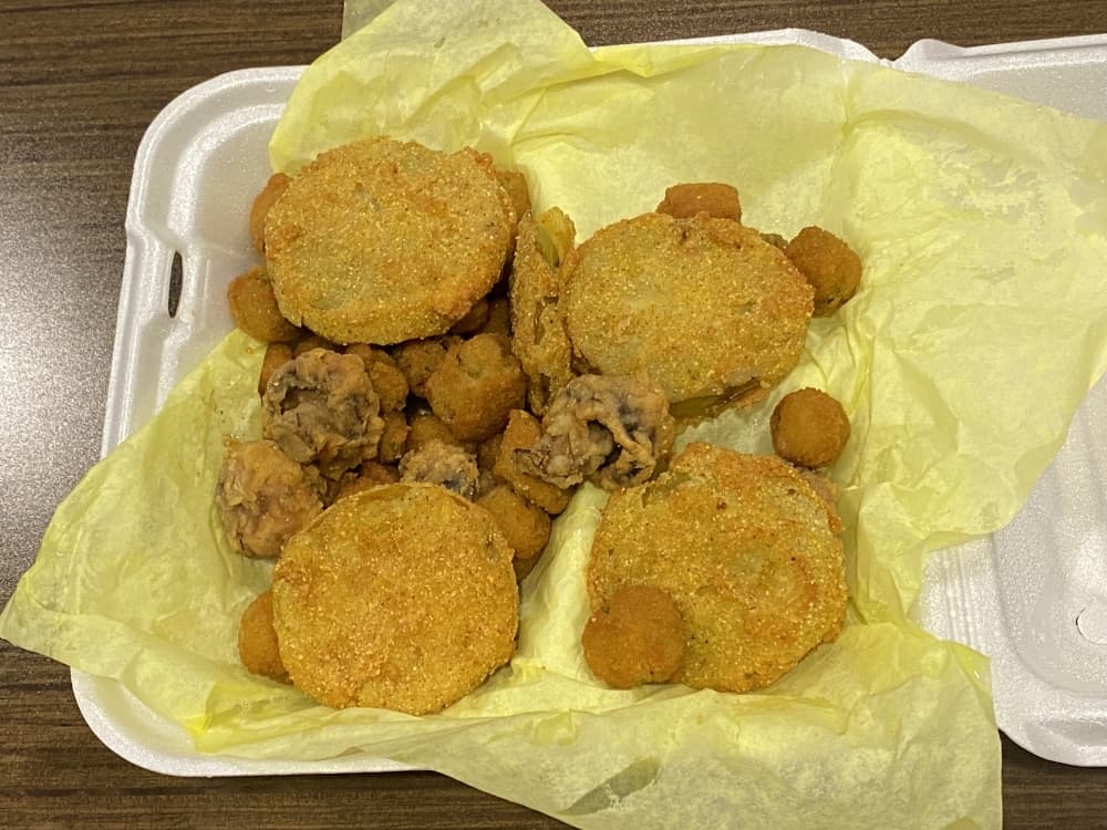 Appetizer sampler platter with fried green tomatoes, mushrooms and okra. (Brooke Sjoberg/Community Impact Newspaper)