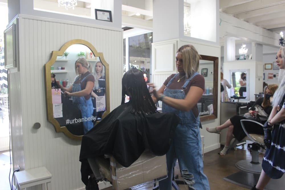 Sylist Madison Berks works on hair at Urban Betty’s 38th Street salon. (Photos by Olivia Aldridge/Community Impact Newspaper)