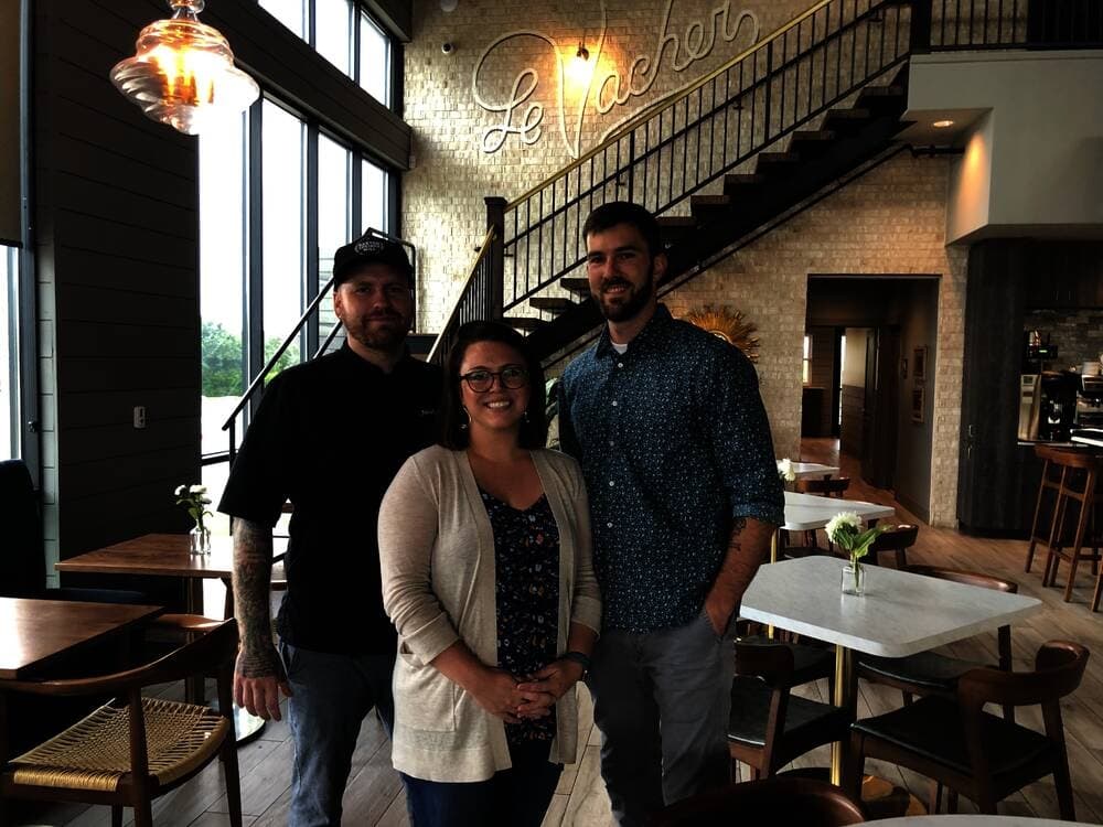 Lauren and Eric Weeks, center and right, run La Vacher, along with Lauren’s brother, Jacob Euler, left, who leads the kitchen. (Community Impact Newspaper/Maggie Quinlan)
