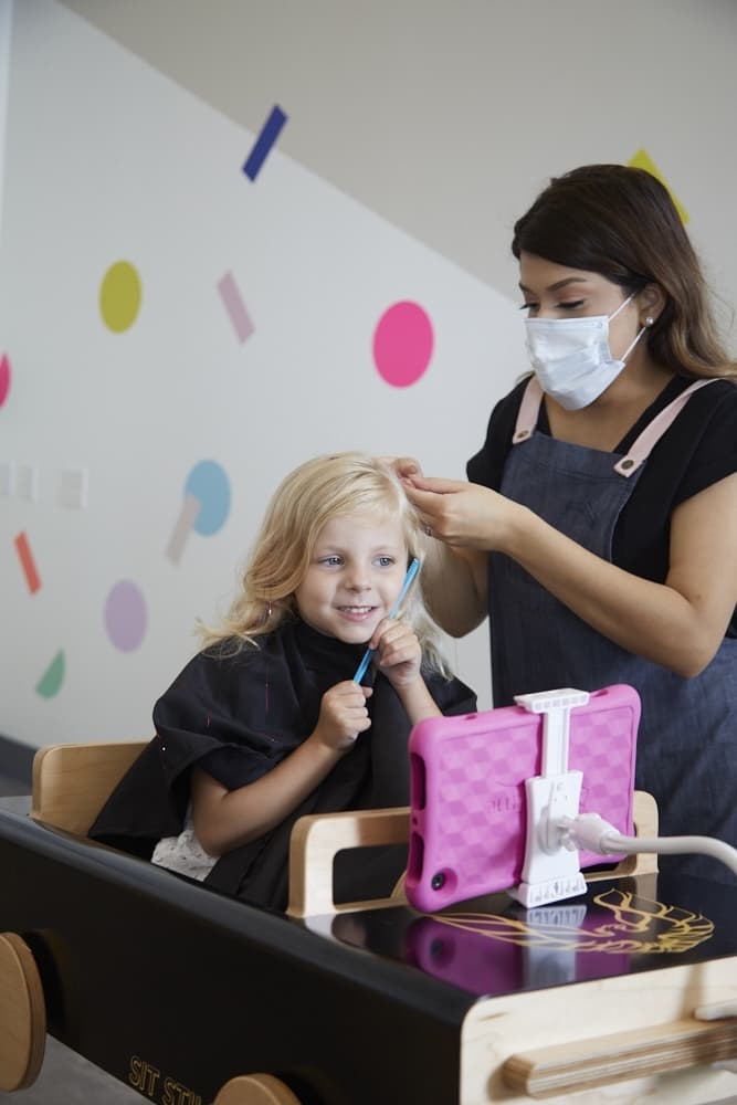 Kids can choose to have color spray or braids added to their hair at the end of their session. (Courtesy Sit Still Kids Salon)