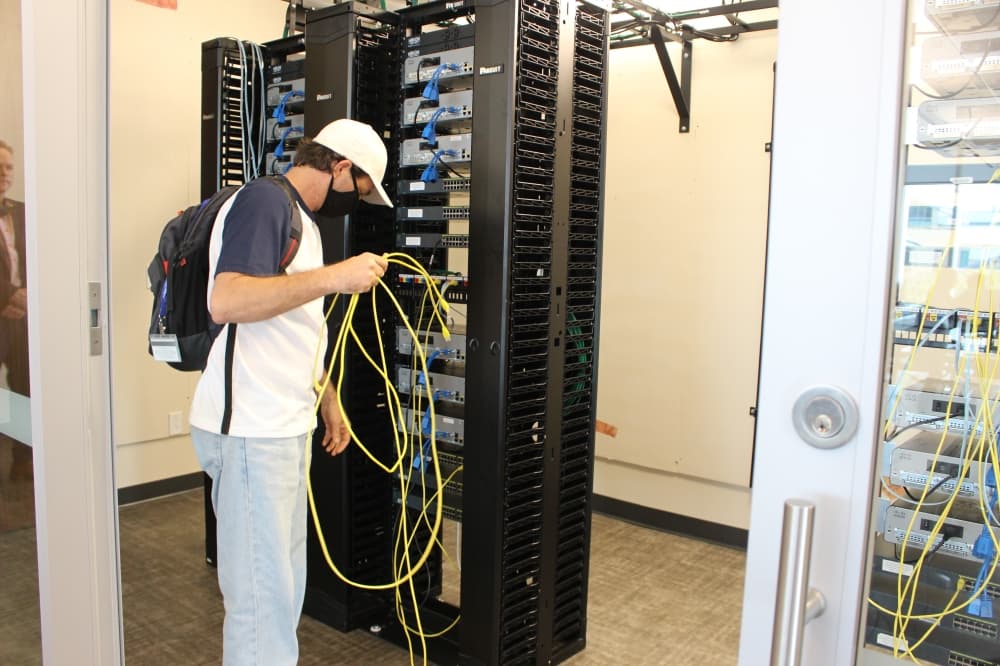 Collin College student Koltin Koehler works in one of the IT Center's labs equipped with Cisco technology. (Brooklynn Cooper/Community Impact Newspaper)