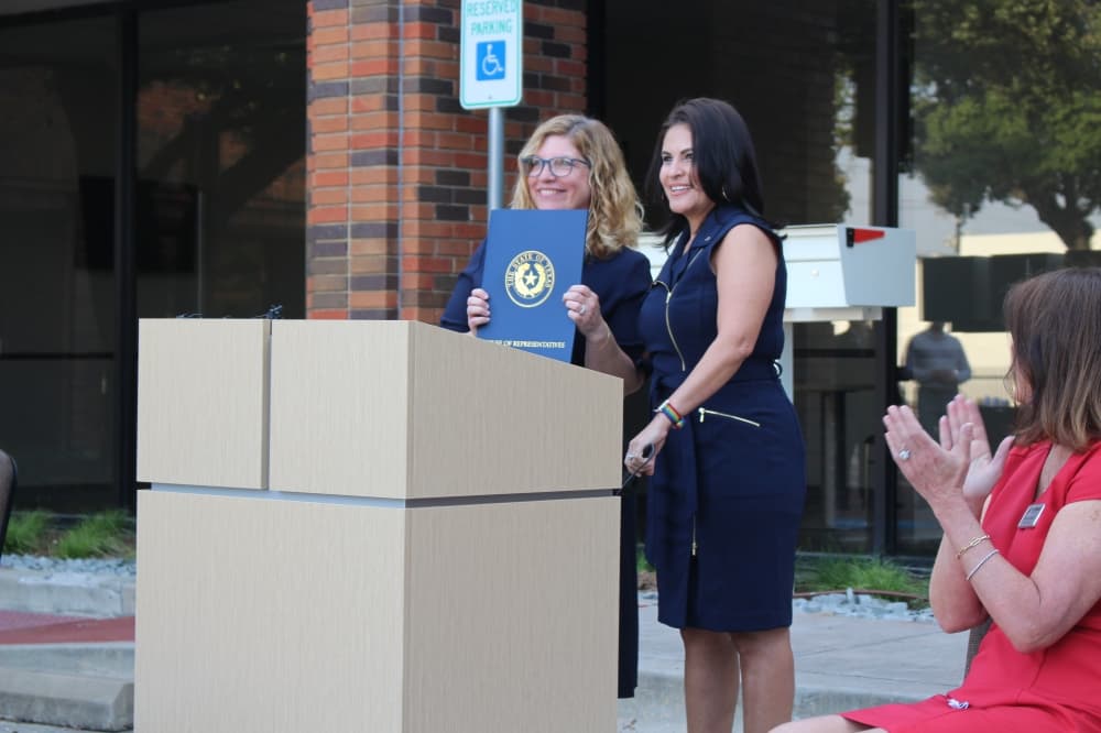 State Rep. Ana-Maria Ramos presents Network President and CEO Cindy Shafer with a formal recognition by the state of Texas of Network's services. (D-Richardson) 
