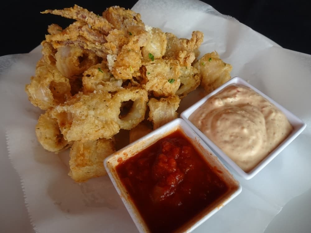 Fritura di calamari is battered and fried squid served with sun dried tomato aioli and marinara ($13). (Emily Jaroszewski/Community Impact Newspaper)