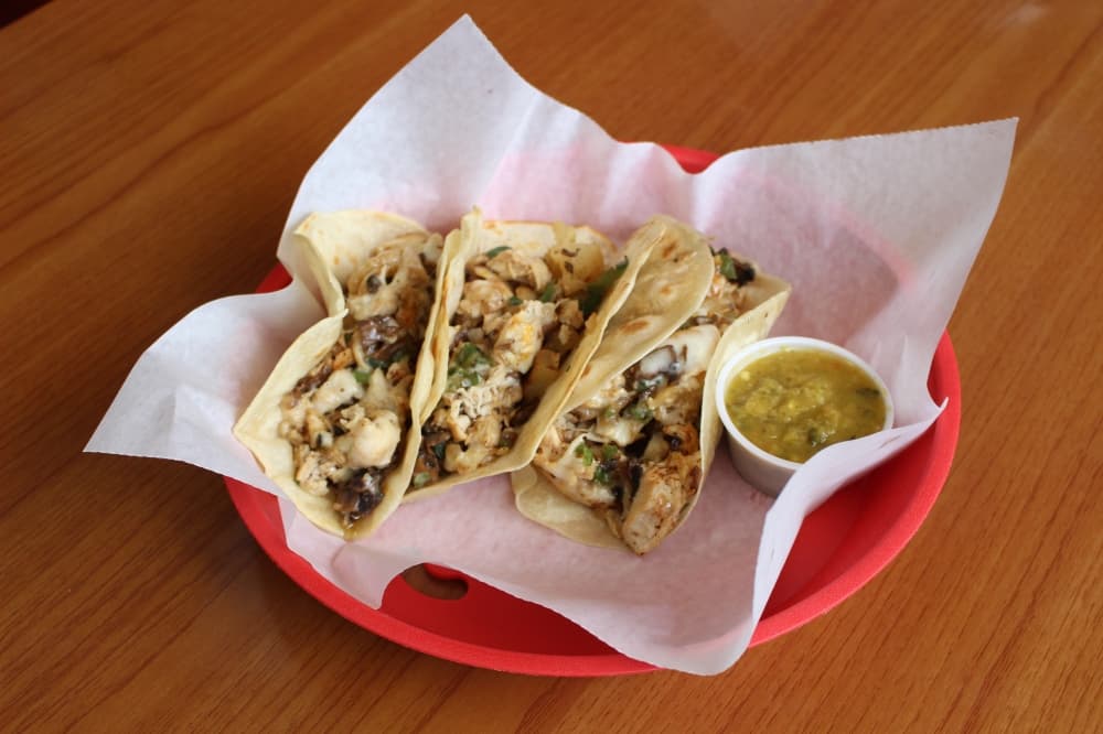 Trash Can Tacos ($13) come with grilled chicken, jalapeños, mushroom and pineapple. (Andrew Christman/Community Impact Newspaper)