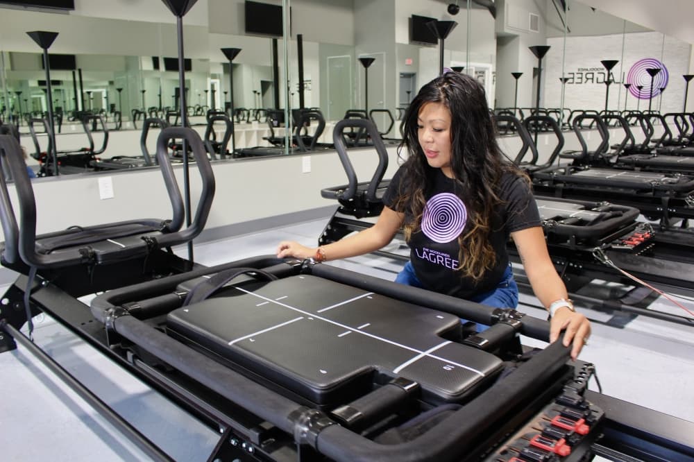 The lagree machines use different resistance levels to perform various exercises. (Ally Bolender/Community Impact Newspaper)

