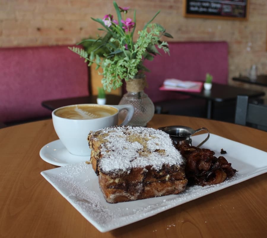 The Nutella Stuffed French Toast ($11) comes with sugar-cured bacon. (Erick Pirayesh/Community Impact Newspaper)