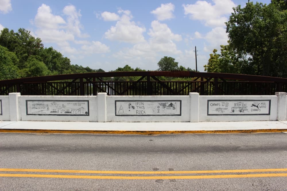 Located on Main Street near Hwy. 6, each panel of the Annette Williamson Wise Bridge shows a different part of Sugar Land history. (Claire Shoop/Community Impact Newspaper)