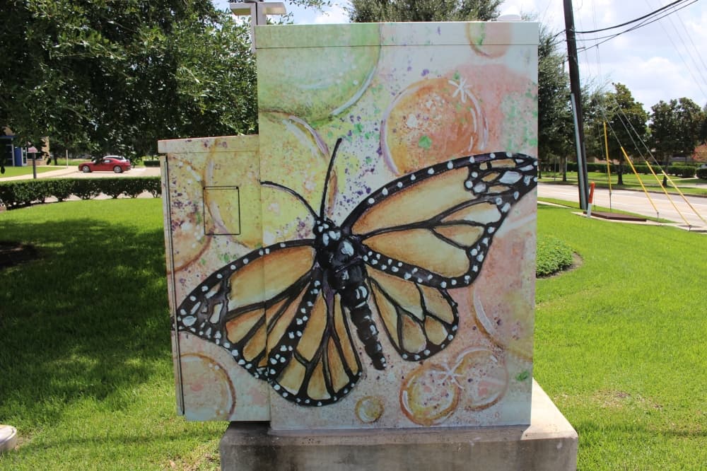 A traffic box by Joy Chandler called "Sweet Transformation" features monarch butterflies, which are native to Sugar Land. (Claire Shoop/Community Impact Newspaper)