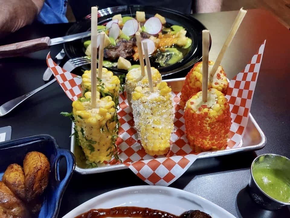 Taste of 3 Street Corn on the Cob ($10) offers diners a chance to sample three different styles of “elote,” a traditional Mexican street food. (Courtesy Fuego Latino Gastropub)