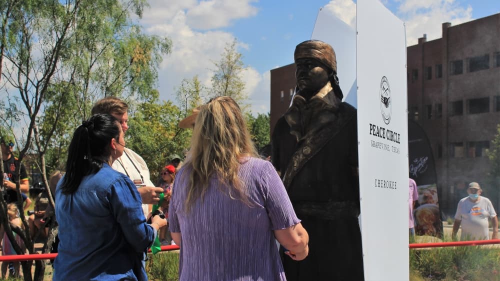 people looking at statue