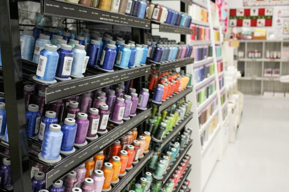 Thread is sold by the spool, starting at $1.99 for a 110-yard spool. (Emily Lincke/Community Impact Newspaper) 