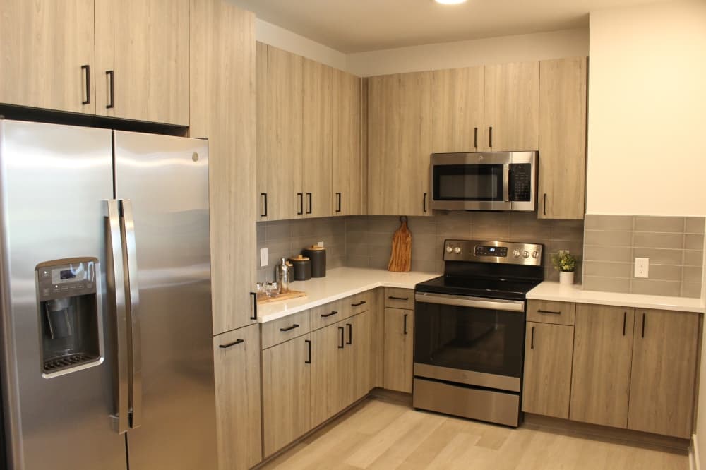 The kitchen layout for a two-bedroom residence is more enclosed to separate it from the rest of the living space. (Andrew Christman/Community Impact Newspaper)