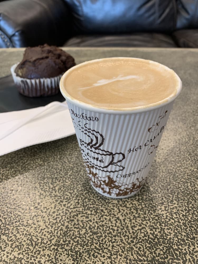 A French vanilla latte and chocolate muffin are among
the offerings at Roscoe’s Coffee House. (Nicole Barron/Community Impact Newspaper)