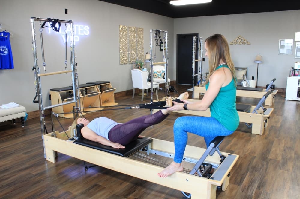 
Valerie Lucas, owner of Pilates VIP, demonstrates exercises on the reformer often used in Pilates. (Photos by Sandra Sadek/Community Impact Newspaper)