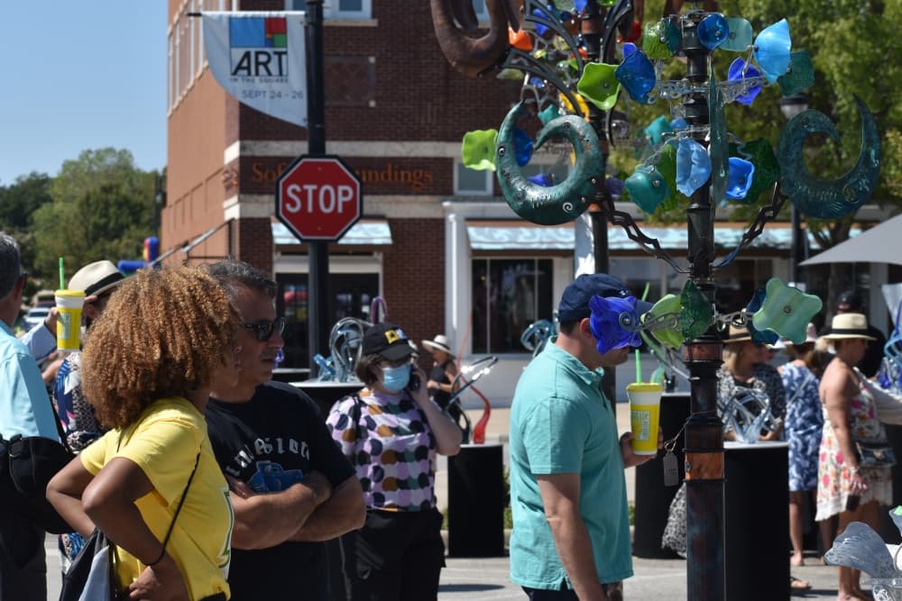 Andrew and Fanci Brown look at glass and metal sculptures at Art in the Square on Sept. 26 in Southlake Town Square. (Anjali Krishna/Community Impact Newspaper)
