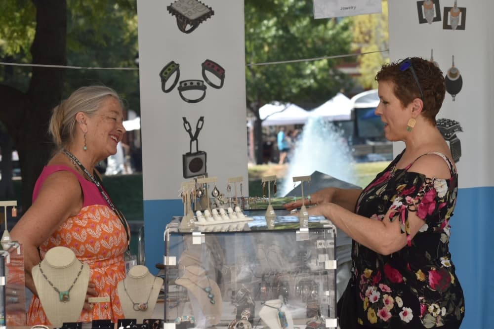 Lisa Bailey markets her family jewelry business, Bailey’s, at Art in the Square on Sept. 26 in Southlake Town Square. (Anjali Krishna/Community Impact Newspaper)