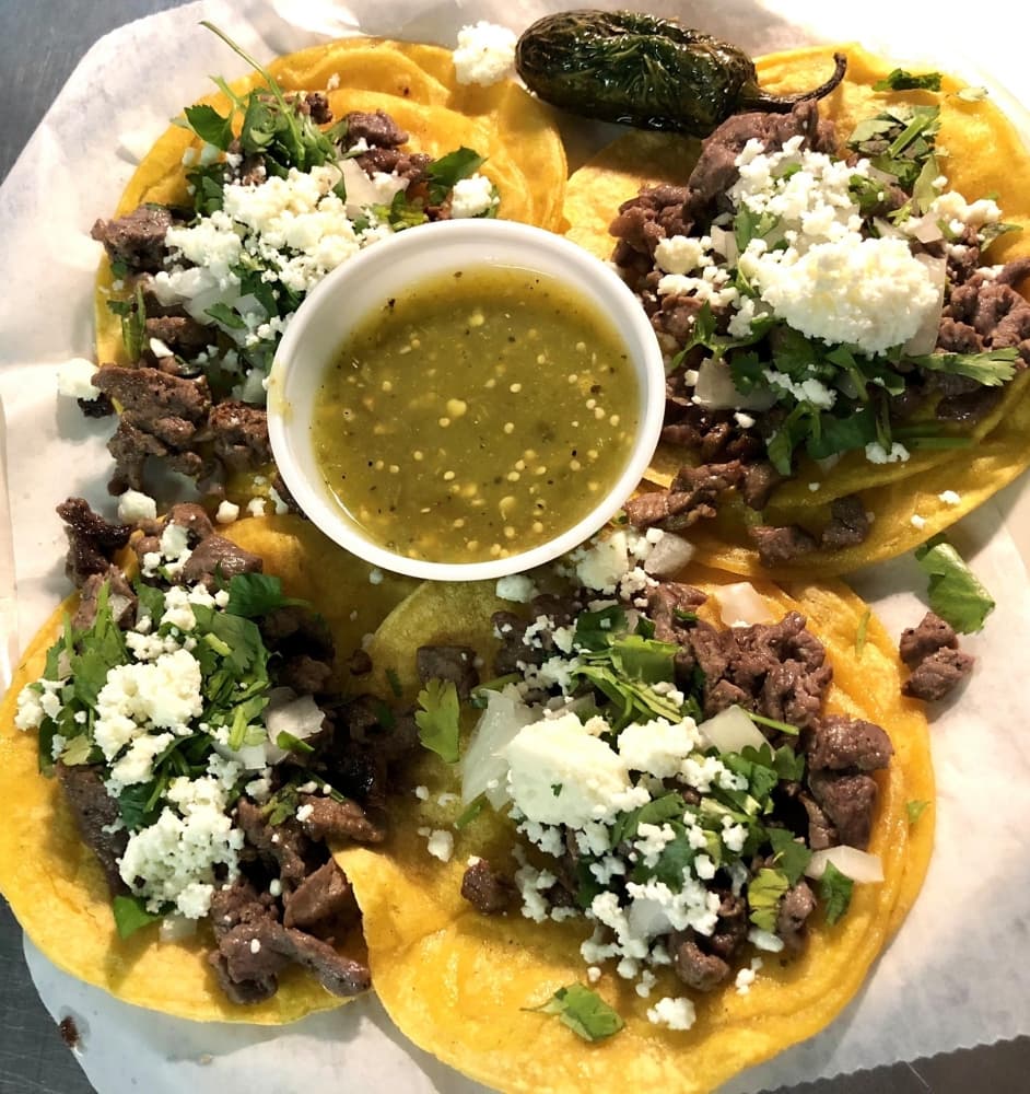 The street taco dinner ($9.99) comes with grilled steak, onions, cilantro and queso on corn tortillas. The entree is served with tomatillo sauce and lime wedges. (Courtesy Herbert's)