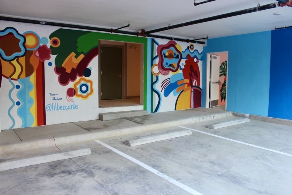 Becca Gordon is one of several Texas artists to paint a mural at the complex. (Ben Thompson/Community Impact Newspaper)