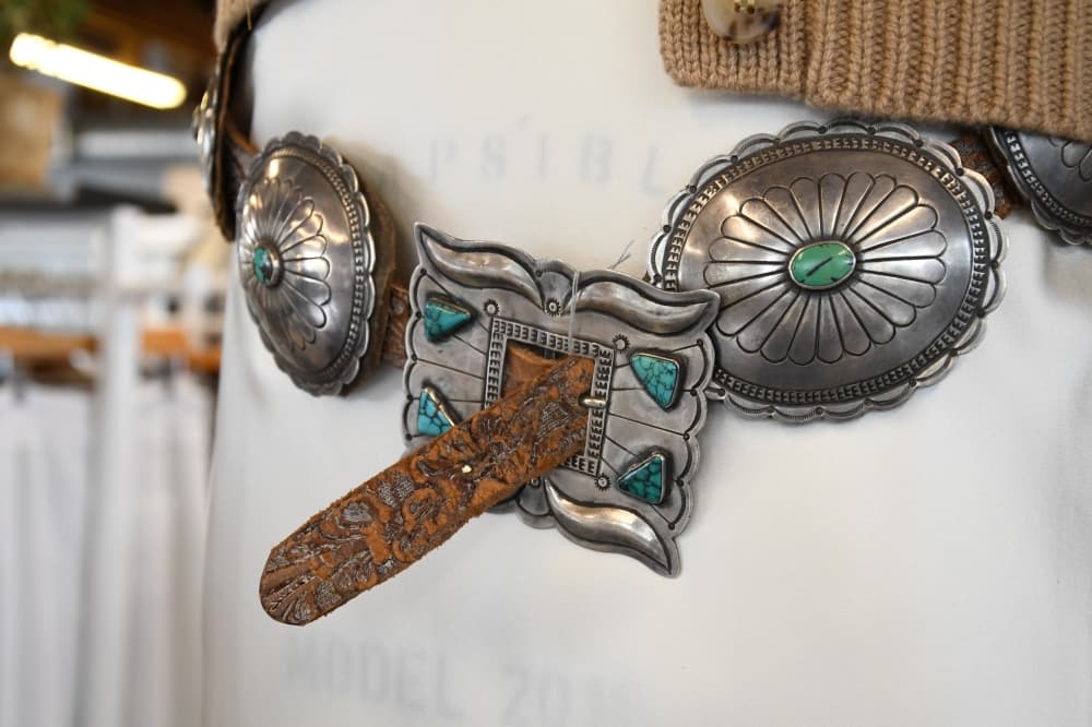 Concho belts are just one unique item of many for sale at Abejas. The store is known for its combination of sophisticated chic and casual clothing. (Hunter Marrow/Community Impact Newspaper)
