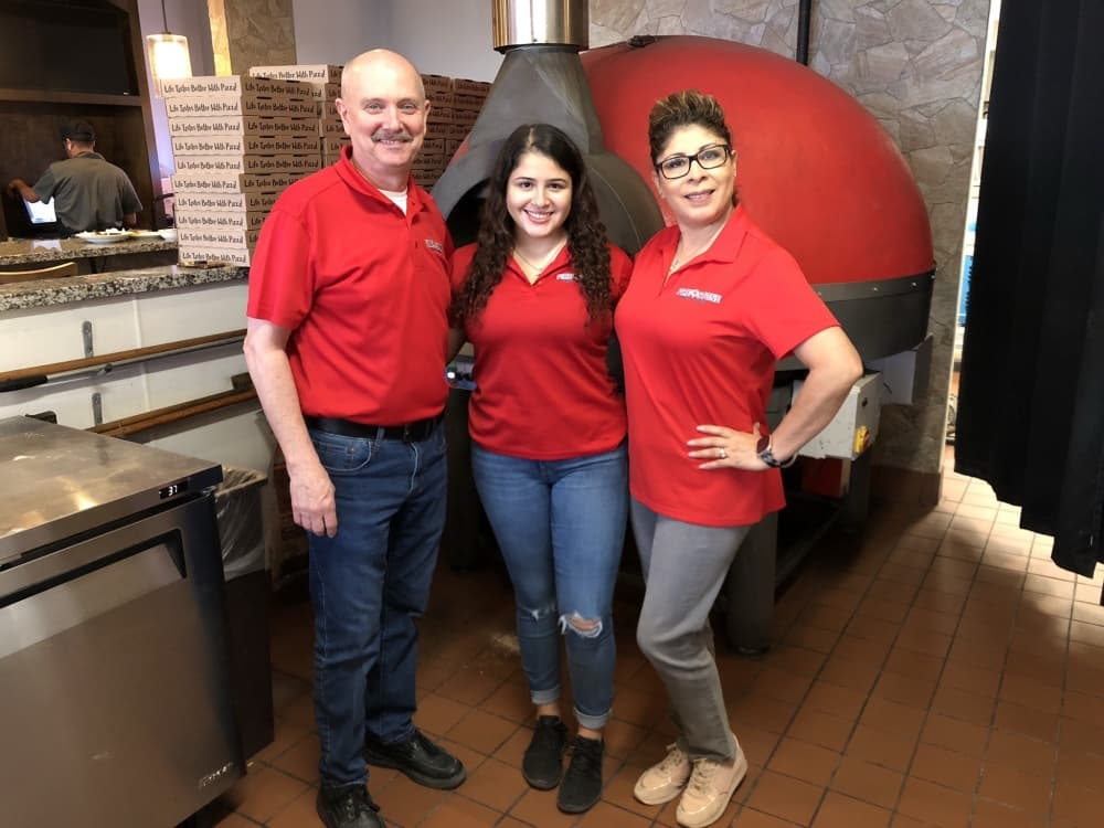 Greg Emmons opened Fire Stone Pizza Bar with help from his wife, Teresa Emmons, and daughter Allison Emmons in 2018. (Andy Yanez/Community Impact Newspaper)