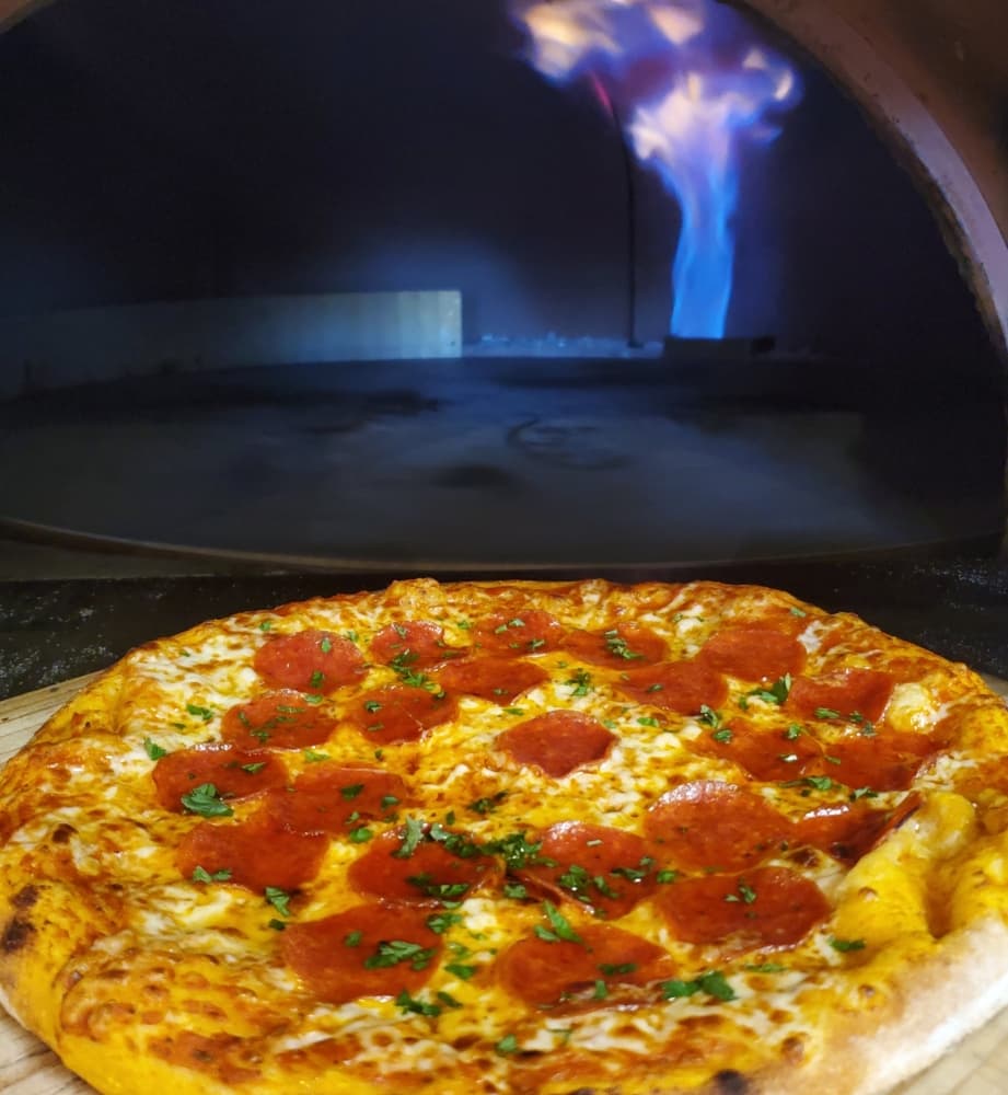Fire Stone Pizza Bar's fire stone oven cooks pizza in four minutes. (Courtesy Fire Stone Pizza Bar)