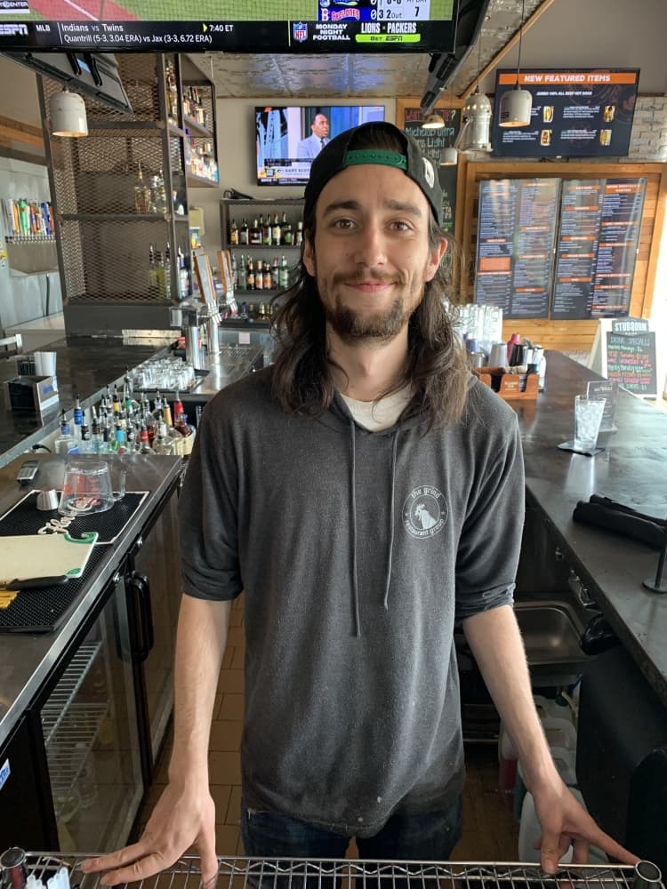 Jake Clouden is the general manager of Grind Burger Bar in McKinney. (Nicole Barron/Community Impact Newspaper)