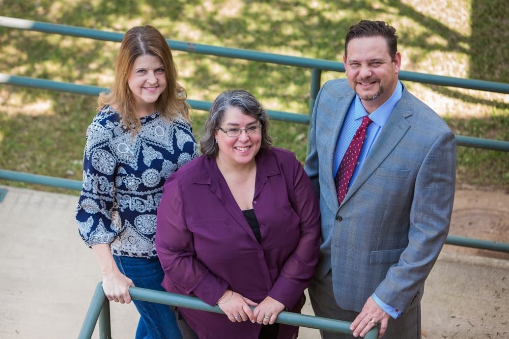 Dee Kohlhoff (left) works alongside Hatfield (center) and Mike Davila (right). (Courtesy College Inroads)