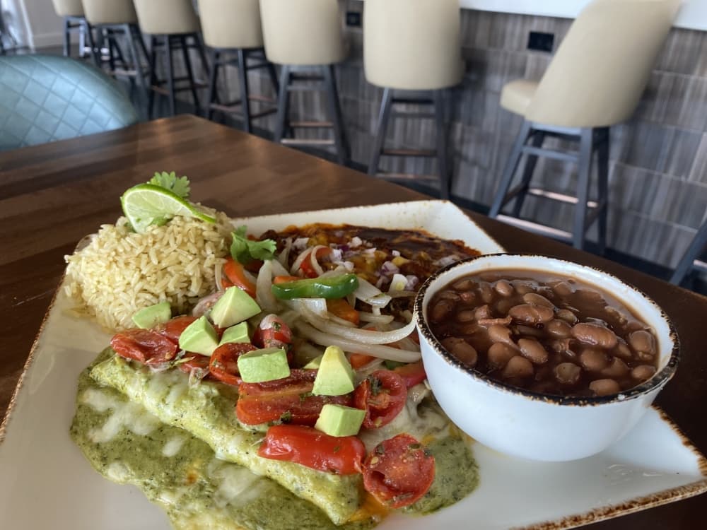 The Mexican Flag enchilada plate has three enchilada varieties: cheese, roasted chicken and fajita beef.
(Ally Bolender/Community Impact Newspaper)