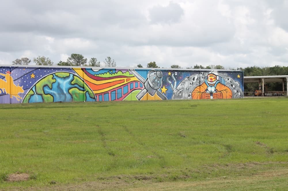 The mural showcases different aspects of Houston, such as its history with space travel. (Sierra Rozen/Community Impact Newspaper)