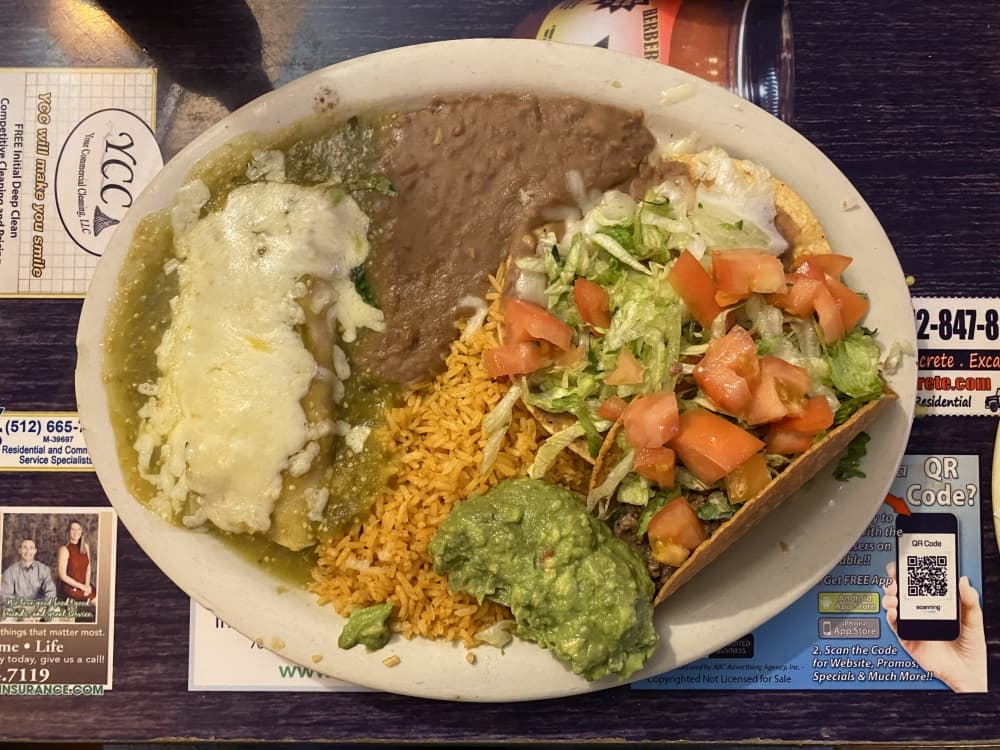 
The plate comes with a crispy taco, chalupa, cheese enchilada, rice, beans and guacamole. ($9.79)