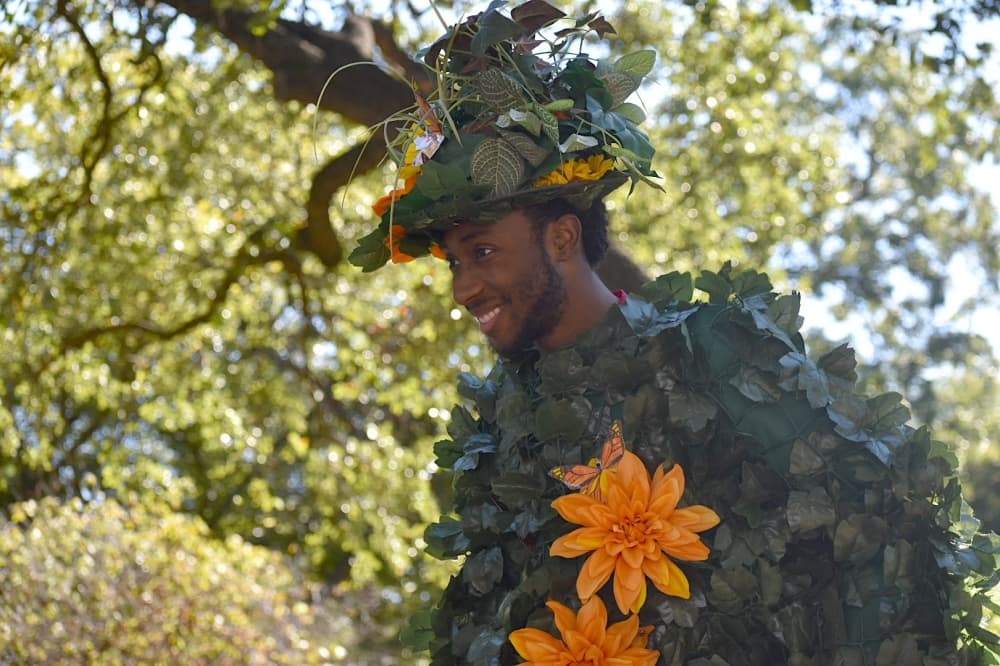 Justin Chapman walks on stilts and in costume at Butterfly Flutterby. (Anjali Krishna/Community Impact Newspaper)