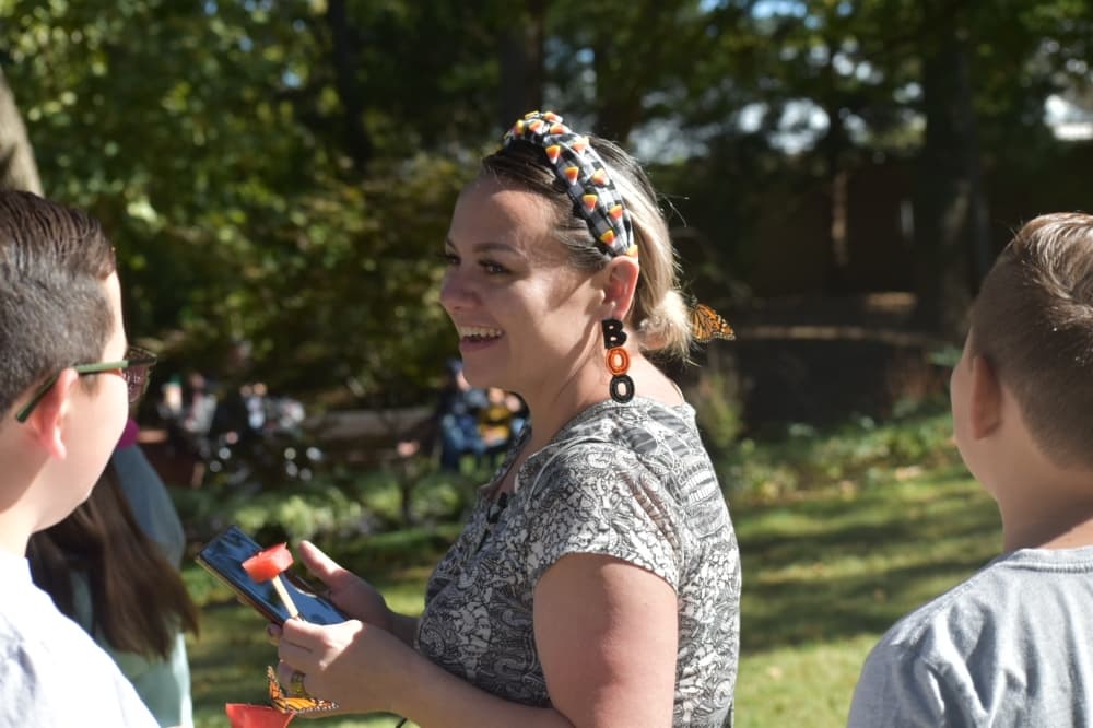 Chrystal Gonzales enjoys the butterfly release at the Butterfly Flutterby event at the Grapevine Botanical Gardens at Heritage Park. (Anjali Krishna/Community Impact Newspaper)
