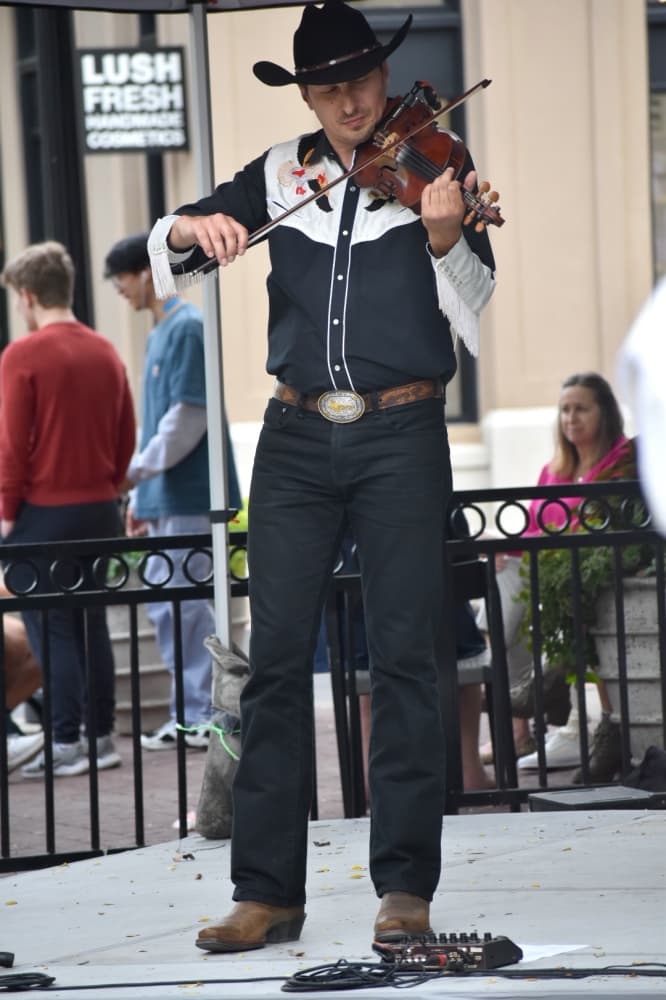Marek Eneti plays violin on the Polka Stage at Oktoberfest on Oct. 17 in Southlake Town Square. (Anjali Krishna/Community Impact Newspaper)