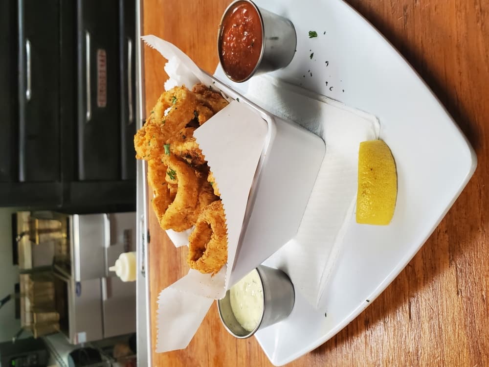 Many regulars come to The Purple Garlic for their famed Calamari ($13). (Jarrett Whitener/Community Impact Newspaper)