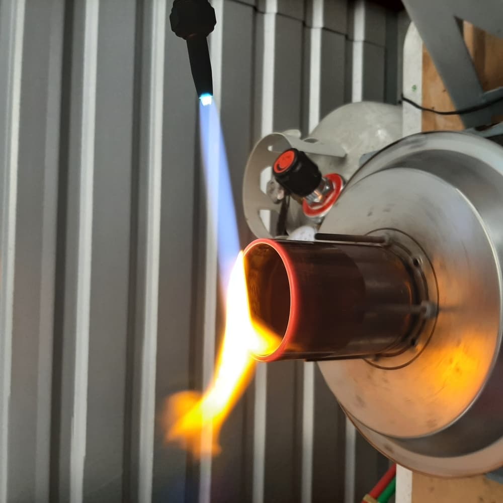 Part of the production process includes sanding and fire glazing the bottles. (Courtesy A Second Round)
