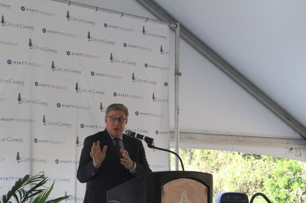 Ray Garfield speaks at a podium 