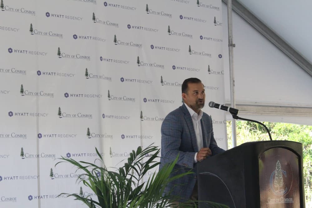 Kimo Bertram speaks at a podium