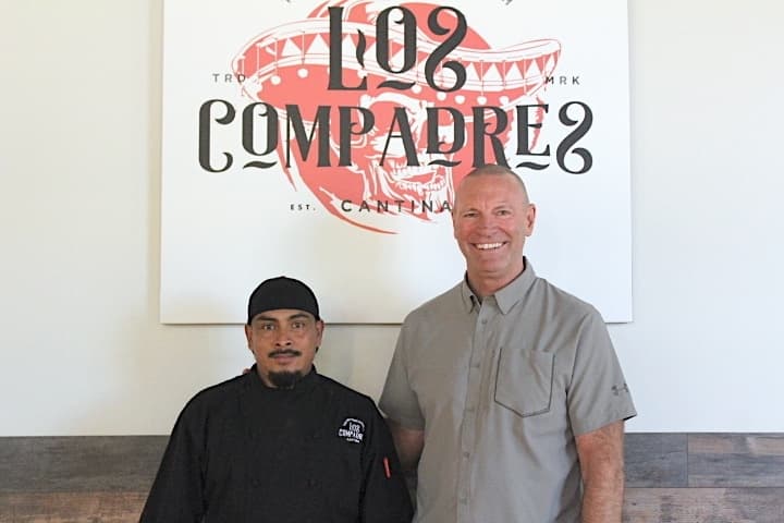 Jose Mendez, left, and Jack Layman met in 1999 and have since opened three restaurants together, including Los Compadres. (Sandra Sadek/Community Impact Newspaper)