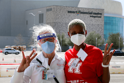 Professor and Founding Dean Kathryn Tart is pictured with a student at vaccination event at the Smart Financial Center in Sugar Land. 