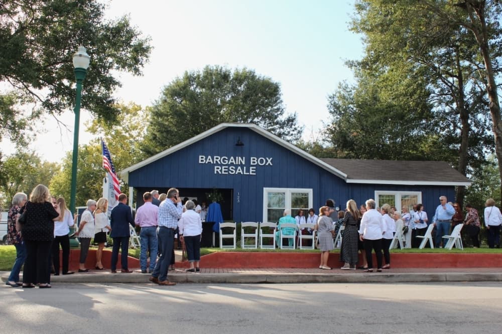 Community members and public officials gathered at the Bargain Box Resale Shop on Oct. 14 to commemorate the unveiling of a historical marker honoring the Conroe Service League. (Anna Lotz/Community Impact Newspaper)