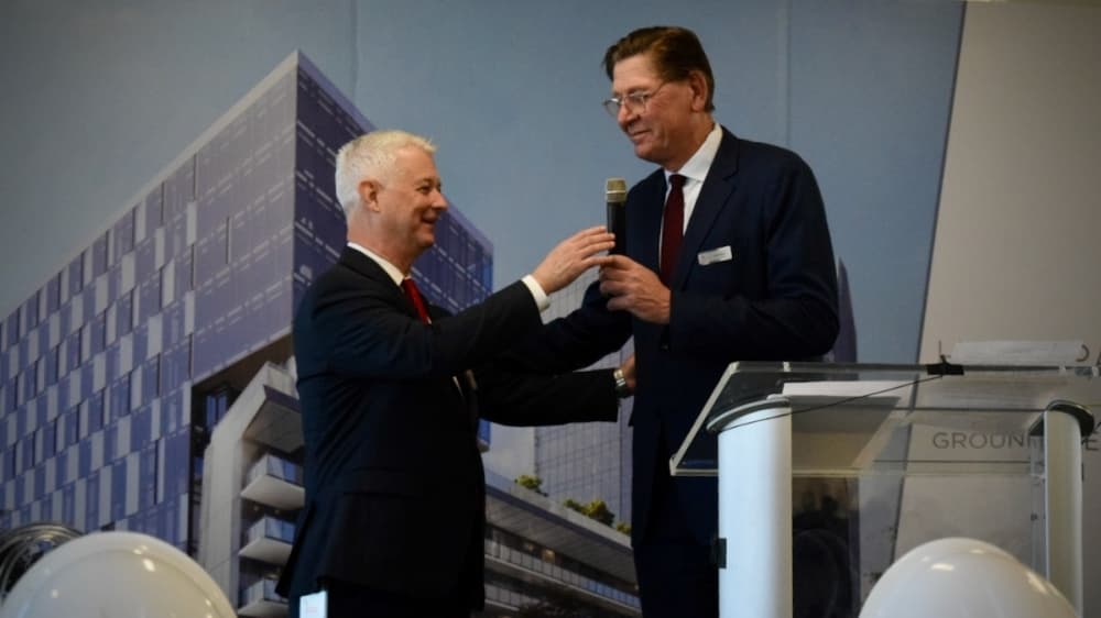 two men at podium