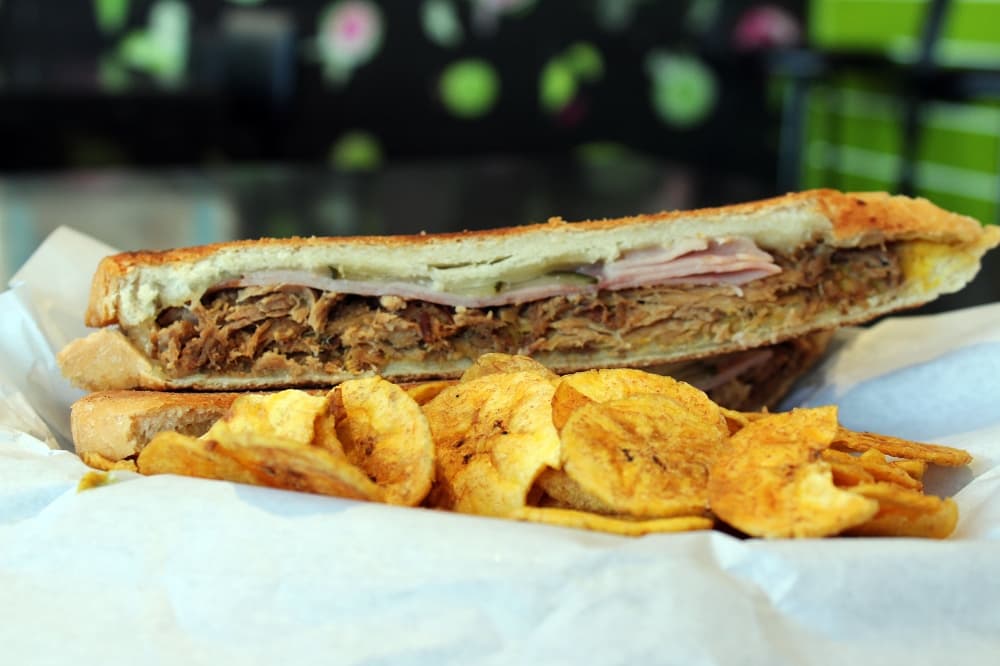 One of Guava Tree’s top two menu items is the El Cubano served with fresh plantain chips. ($13.00) (Karen Chaney/Community Impact Newspaper)