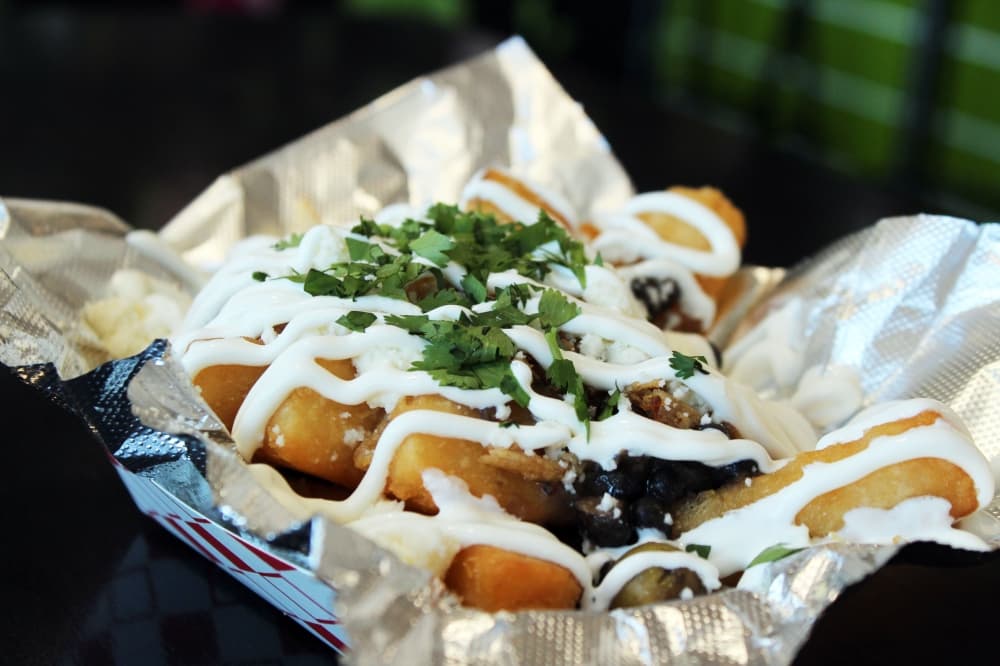 Another of the top menu items is the Loaded Yuca Fries ($11). Onel described yucas as having a unique flavor and that they are a little starchier than a potato. (Karen Chaney/Community Impact Newspaper)