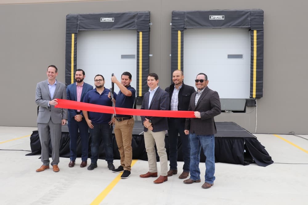 Plastikon representatives commemorate coming to Kyle with a ribbon cutting. (Zara Flores/Community Impact Newspaper)
